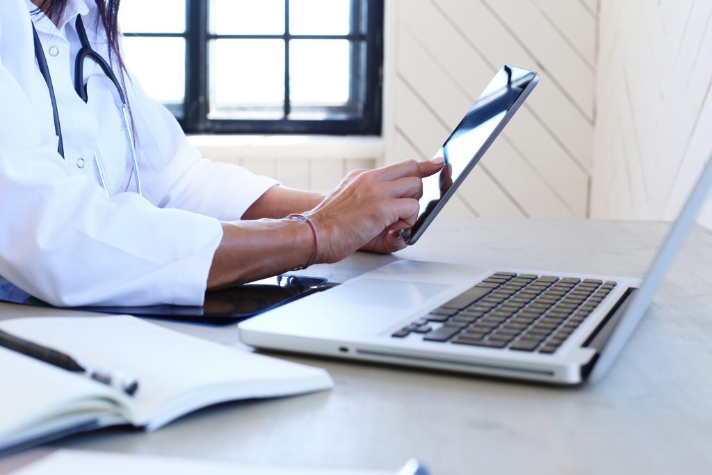 Doctor in hospital using iPad